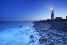 The Portland Bill Lighthouse In Dorset, England At Night