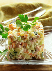 Wall Mural - Traditional Russian salad with mayonnaise and vegetables