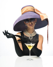 A Girl In A Big Hat And Sunglasses, Like A Movie Star, Drinking Martinis