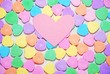 Candy hearts with a blank pink heart on top, can be used to add a message