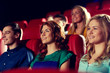 © Syda Productions - happy friends watching movie in theater
