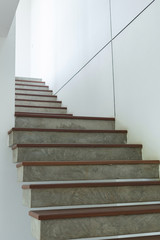 Wall Mural - cement and wood staircase on white mortar wall