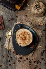 Wall Mural - Cup of coffee with coffee beans and chocolate