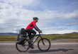 © lkoimages - Happy biker ride on road in Iceland. Travel and sport picture