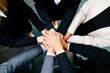© baranq - Overhead picture of business people joining hands