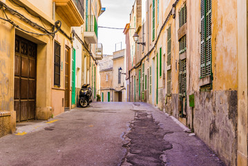 Fototapete - Old town street with ancient rustic mediterranean houses