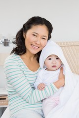 happy mother with baby daughter