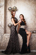 © cherry_d - Portrait of beautiful twins young women in gorgeous evening dresses