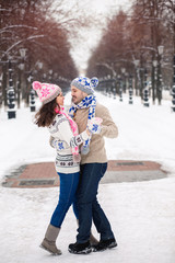 Wall Mural - Young couple in love dancing in winter Park