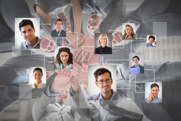 Canvas Print - Composite image of smiling business team standing in circle hand