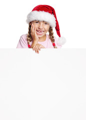 Wall Mural - Little girl in Santa hat with white blank