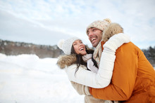 Happy Couple Hugging Outdoors In Winter