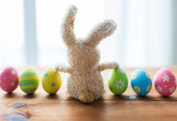 close up of colored easter eggs and bunny