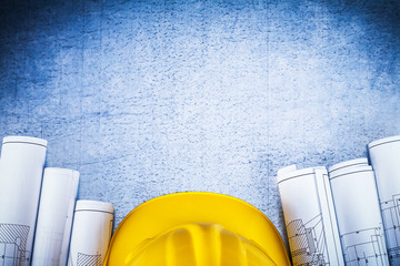 Wall Mural - Copy space image of blueprints with protective hard hat on silve