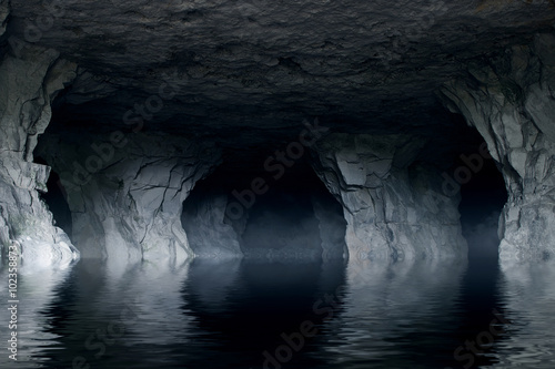 Fotomural underground river in a dark stone cave