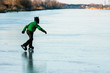 A boy skating on the frozen lake
