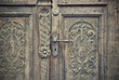 details of a old carved wooden door, vintage filtered style
