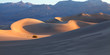 Sand Dune Sunrise - Early morning sunlight creeps into the wind swept depressions of Death Valley's dune field.