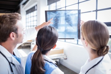 Medical team looking at x-ray together