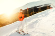 © aboutmomentsimages - Portrait of woman on skis during winter season. Girl skiing in a mountain resort on the slopes