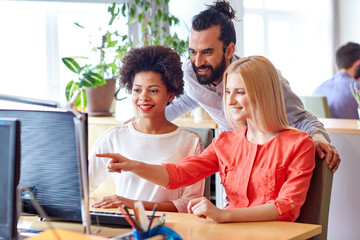 Canvas Print - happy creative team with computer in office