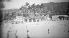 1953: Waikiki Beach Underdeveloped Diamondhead Visitors Playing.  HONOLULU, HAWAII