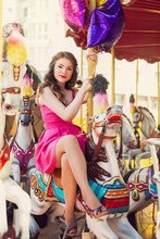 Beautiful Young Girl On A Merry Go Round