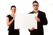 © Samo Trebizan - Confident business couple standing next to a big blank board to