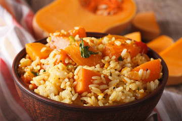 Dietary food: rice with pumpkin macro on the table.  Horizontal
