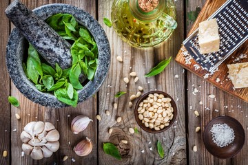 Wall Mural - ingredients for pesto: basil, parmesan, pine nuts, garlic, olive oil and salt