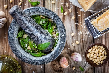 Wall Mural - ingredients for pesto: basil, parmesan, pine nuts, garlic, olive oil