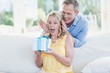 © WavebreakmediaMicro - Husband surprising wife with a present