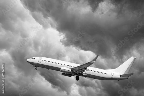 Naklejka dekoracyjna Plane at takeoff, the plane on background of clouds