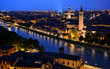 Verona skyline at night with Sant'Anastasia church in the foreground