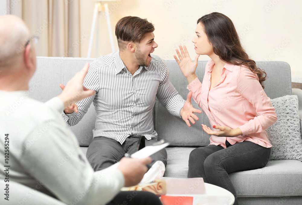 Young couple with problem on reception for family psychologist