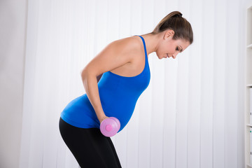 Wall Mural - Pregnant Female Doing Exercise