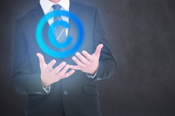 Canvas Print - Composite image of businessman gesturing with his hands