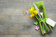 Easter table setting with daffodil and cutlery