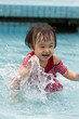 Leinwandbild Motiv Chinese Little Girl Playing in Water