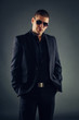 © djile - Handsome macho man in suit and sunglasses