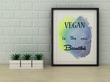 Fototapeta  - Veganism concept. Vegan is the new Beautiful poster in frame