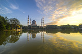 Fototapeta Boho - The Beautiful Sultan Salahuddin Abdul Aziz Shah Mosque (also known as the Blue Mosque) with nature sunrise lighting and reflection..