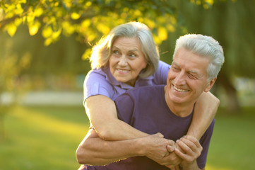 Wall Mural - mature couple   in summer park