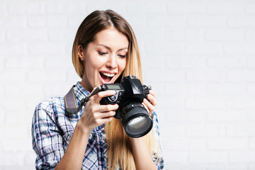 Woman photographer takes images with dslr camera