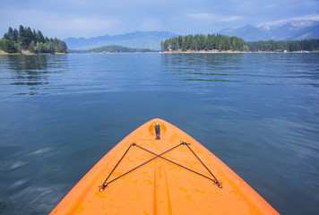 Point of view image of kayaking or paddle boarding on a beautiful Mountain. Wide angle view of nature's beauty