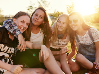 Teenage girls hugging