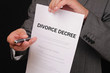 © dream@do - Divorce  concept. Man offering a pen to sign divorce decree close up.