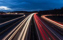 White And Red Car Light Trails On Motorway Junction