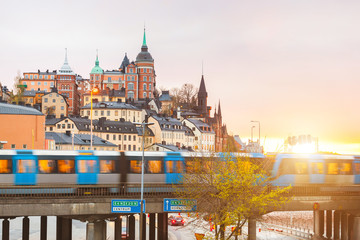 Wall Mural - Stockholm, view of buildings and train at dusk