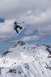 © Vasily Merkushev - Flying snowboarder on mountains. Extreme sport.